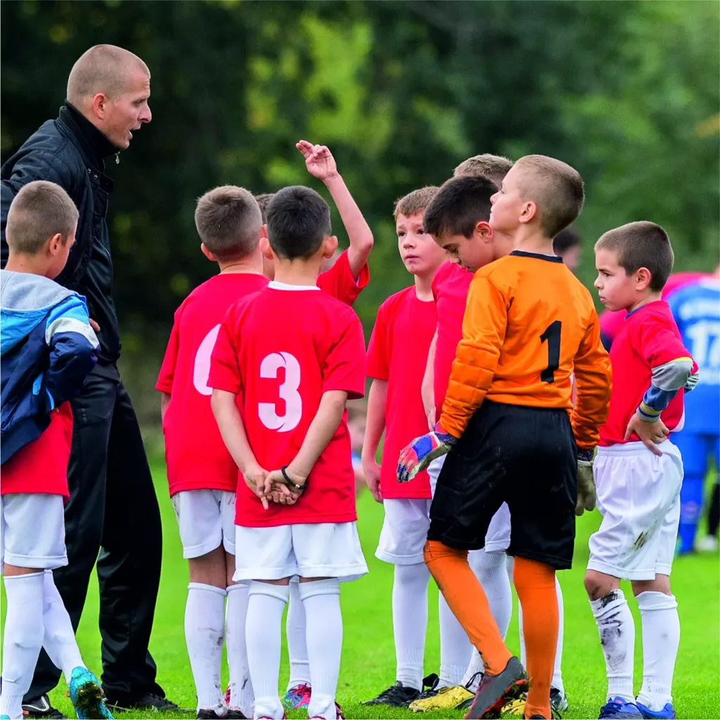 Young boys getting ready to play football